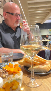 Photo of Keith from Skillet sniffing wine during a wine tasting.