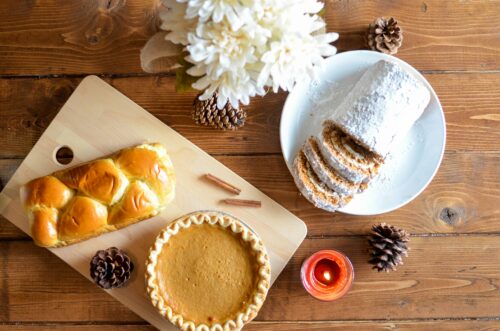 decorative only photo of pie, rolls and cake on a wooden table. source element5 digital on unsplash